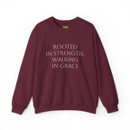 Maroon crewneck sweatshirt with light-colored 'Rooted in strength, walking in grace' lettering across the chest, front flat lay.