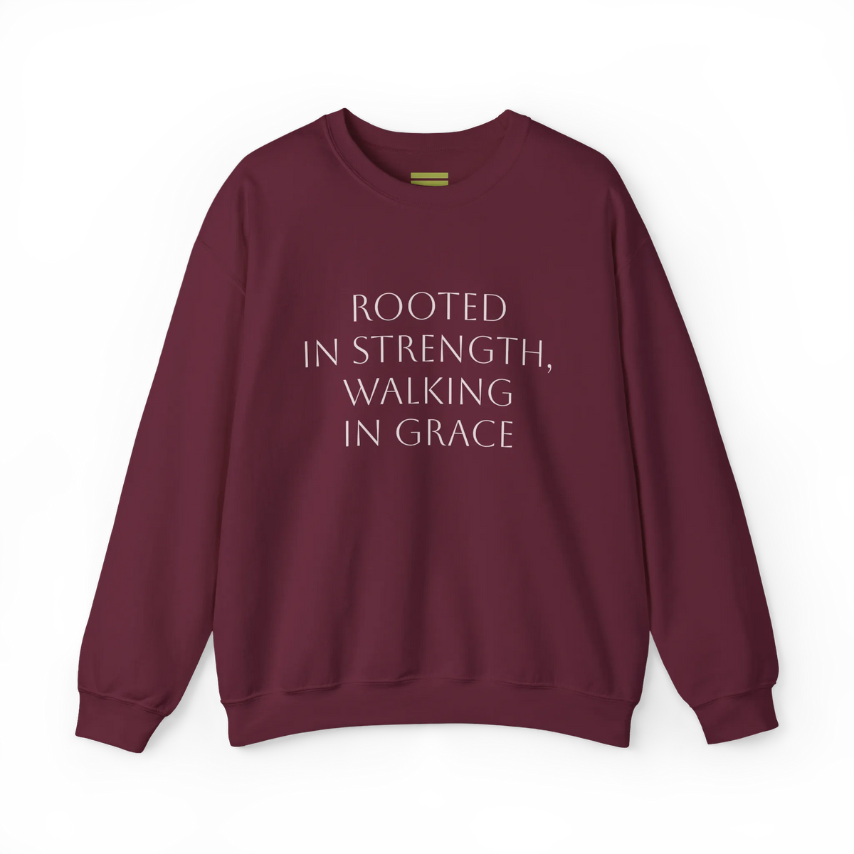 Maroon crewneck sweatshirt with light-colored 'Rooted in strength, walking in grace' lettering across the chest, front flat lay.