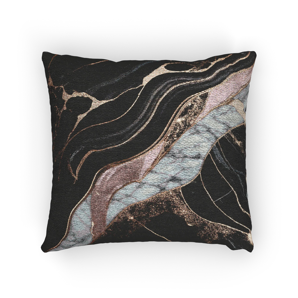 A horizontal view of the Rose Gold Marble Woven Pillow showing rose gold veins and white marble with black veins on a charcoal background. 