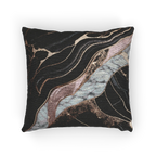 A horizontal view of the Rose Gold Marble Woven Pillow showing rose gold veins and white marble with black veins on a charcoal background. 