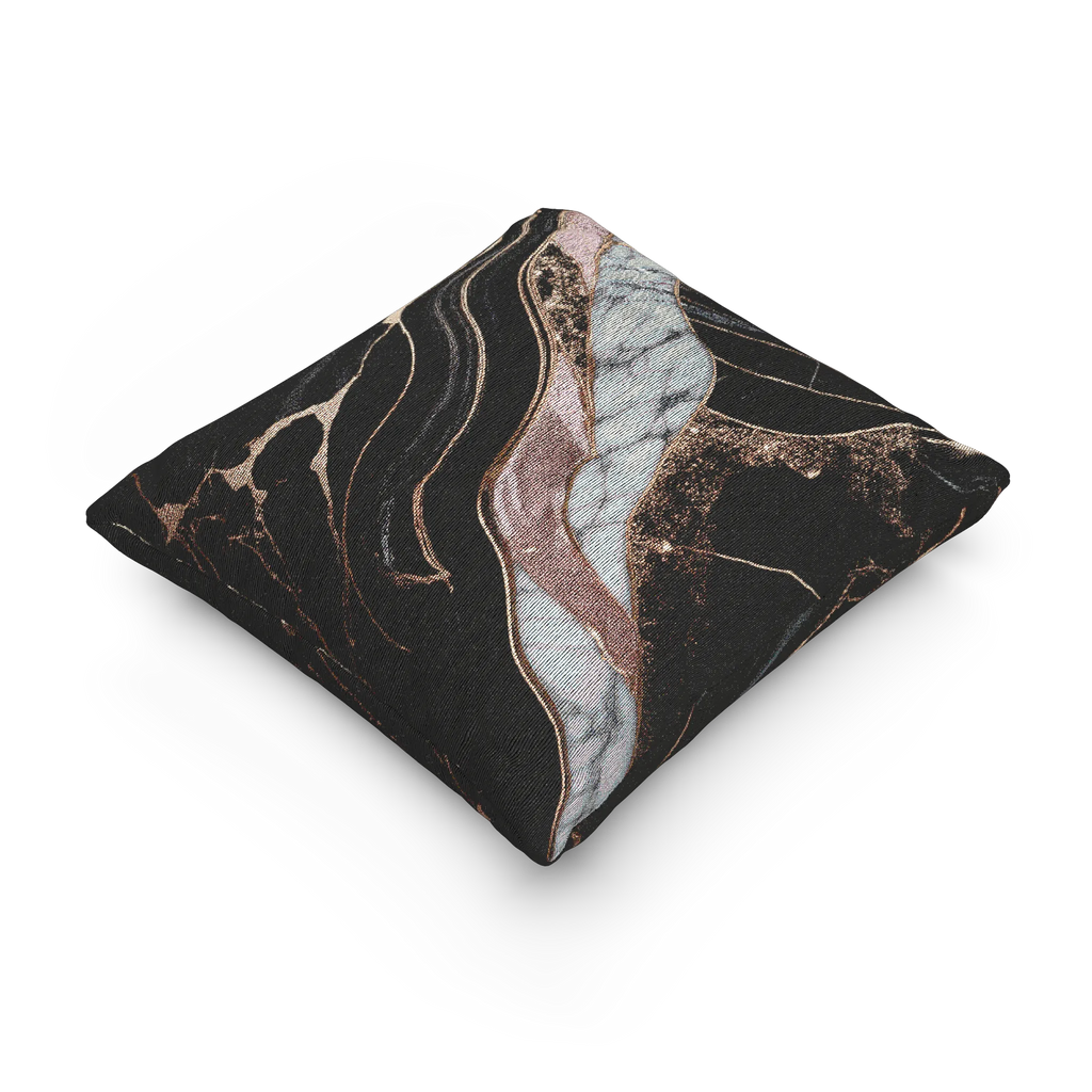 A side view of the Rose Gold Marble Woven Pillow showing rose gold veins and white marble with black veins on a charcoal background. 
