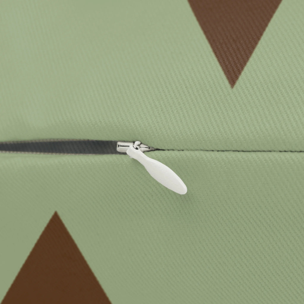 Sage chocolate triangle pattern lumbar pillow, zipper view.