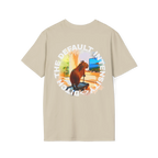 A sand t-shirt featuring a capybara on a treadmill graphic with white Ditch The Default Intensity circular text on the back.
