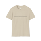 A sand t-shirt with black Focus On The Quiet Moments text on the chest.
