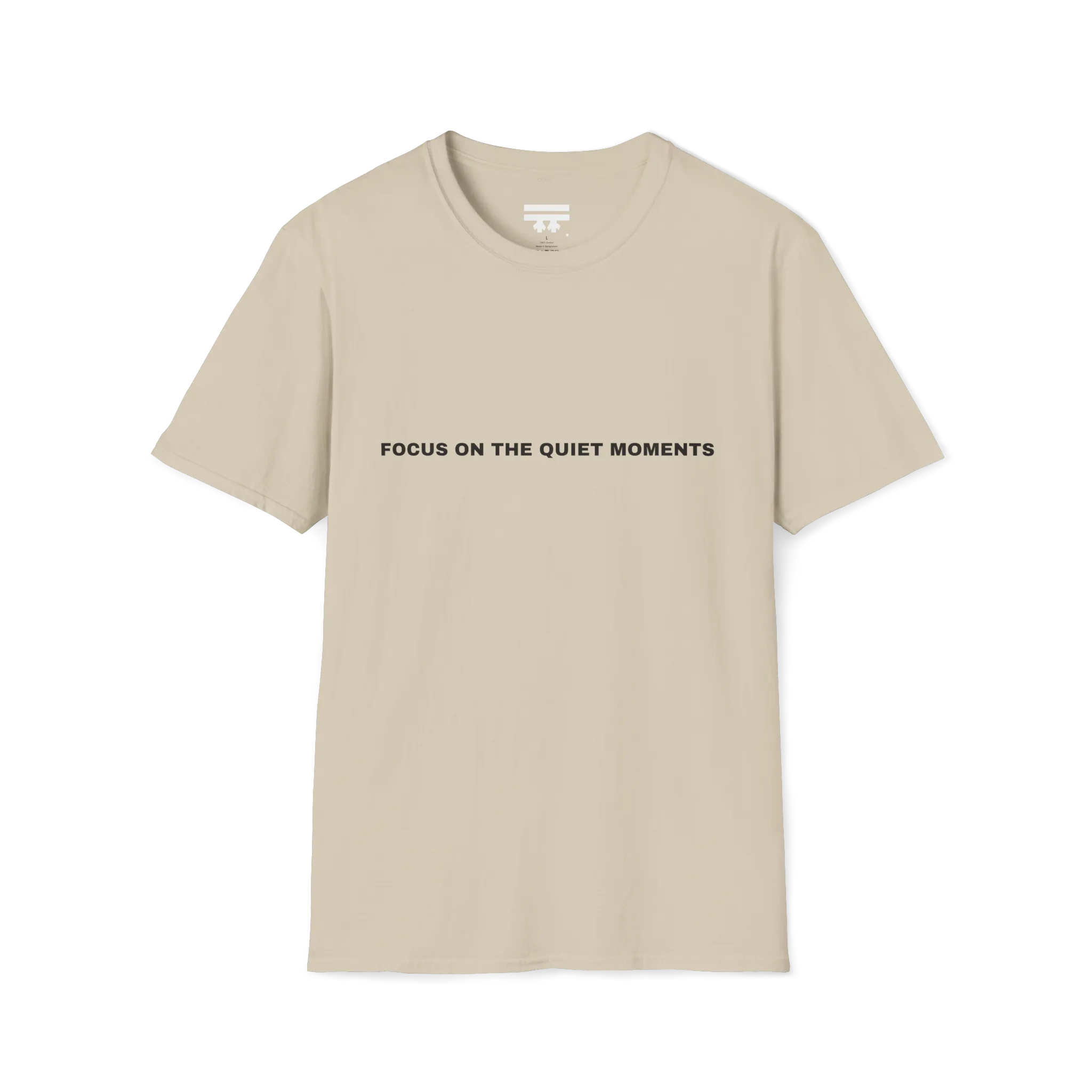 A sand t-shirt with black Focus On The Quiet Moments text on the chest.