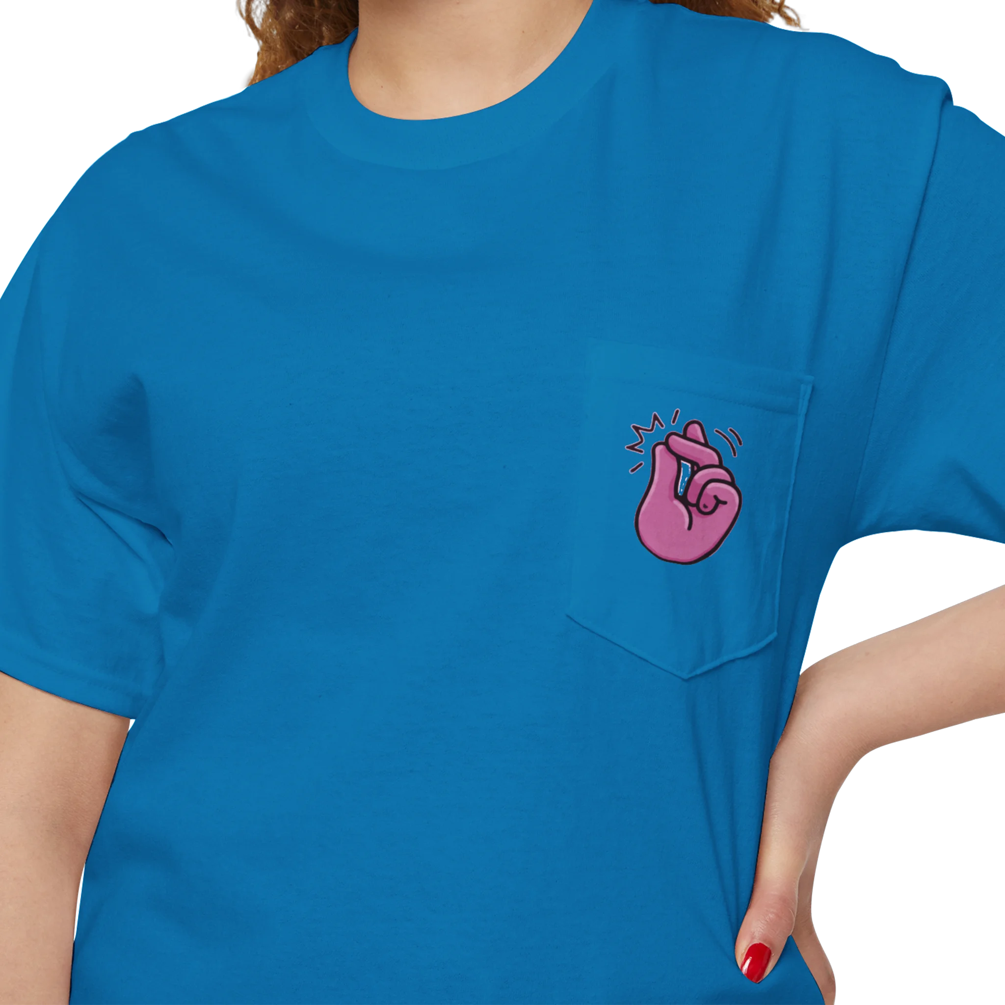 A person wearing a FREEBRD sapphire classic cotton pocket t-shirt with a baby pink cartoon finger-snap Clock It graphic printed on the front chest pocket.