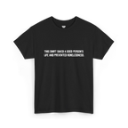 Black cotton t-shirt with white block text reading This shirt saved a good person's life and prevented homelessness, front view, flat lay.