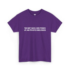 Purple cotton t-shirt with white block text reading This shirt saved a good person's life and prevented homelessness, front view, flat lay.