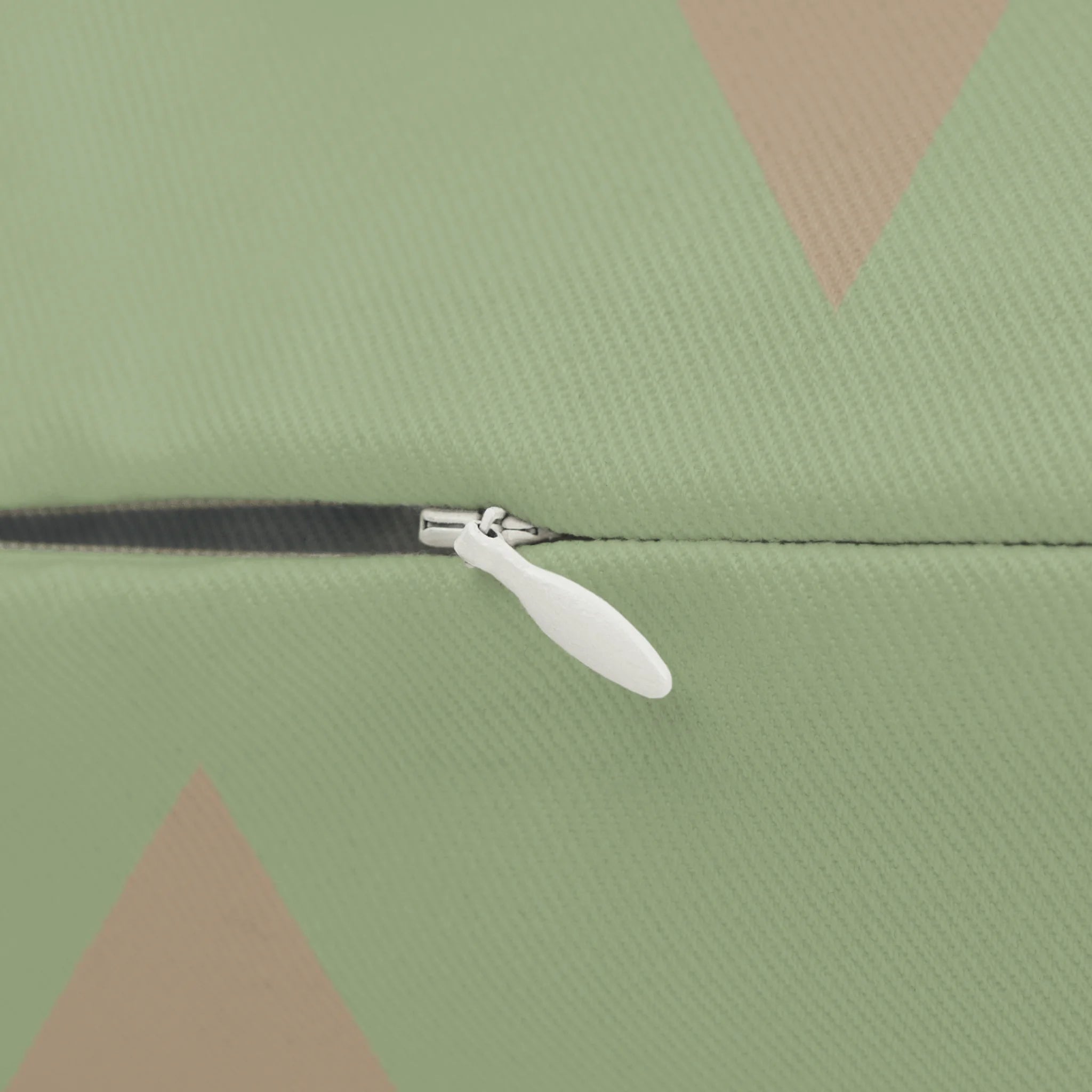 Schist Green triangle lumbar pillow, zipper view.