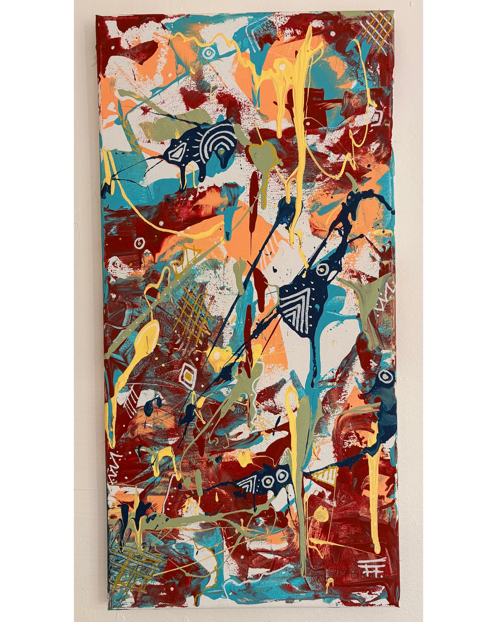 Vertical abstract painting with deep red, turquoise, peach, yellow, and white layered marks, photographed against a light wall.