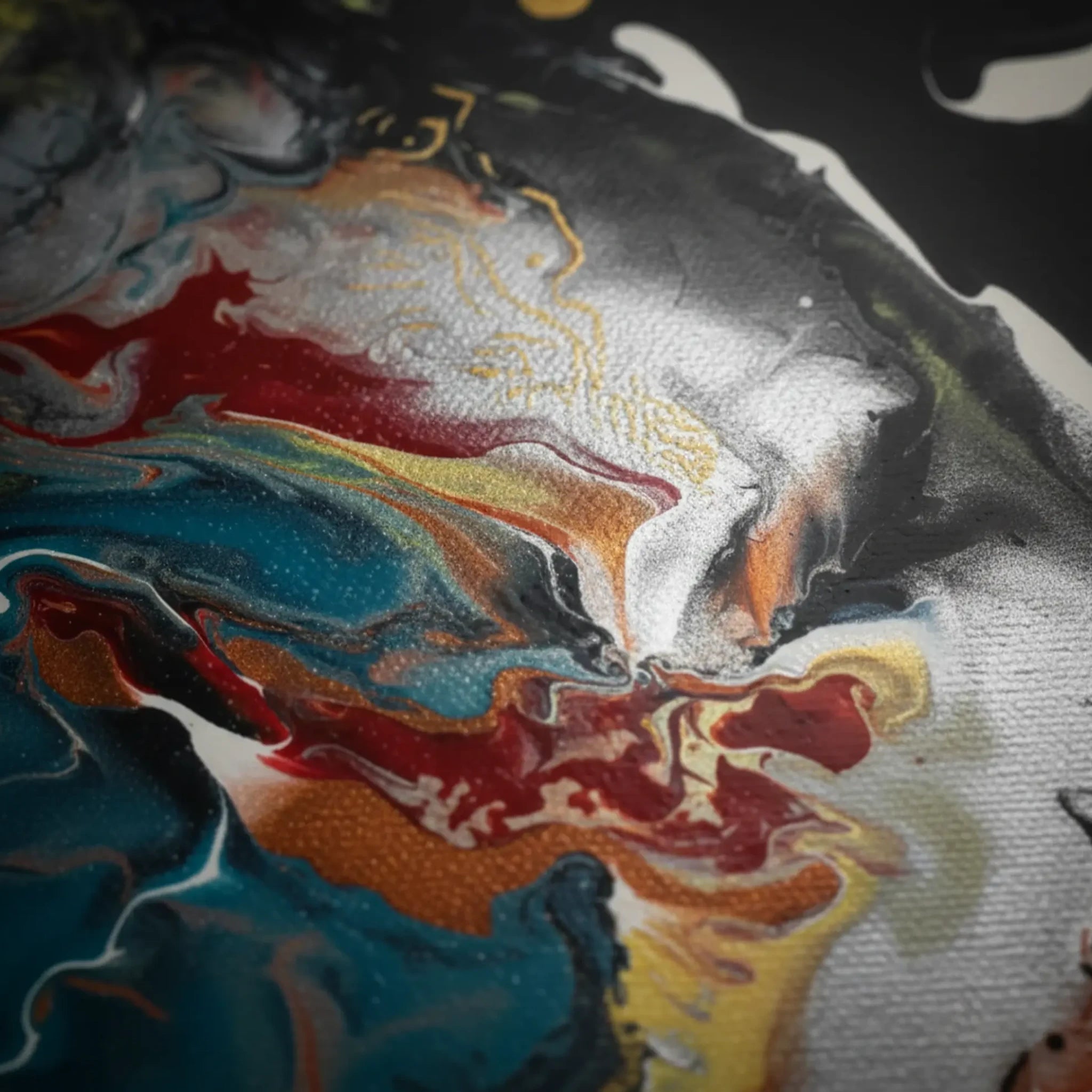 Close-up texture detail of "Silver Bird" framed abstract canvas by FREEBRD — fluid pour art in black, silver, red, teal, and gold on premium DTF canvas with archival matte finish.
