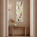 "Slim Sage" Tall Framed Canvas Art by FREEBRD — sage green abstract vertical canvas styled in a warm residential hallway above a console table, natural home setting, earthy minimalist decor.