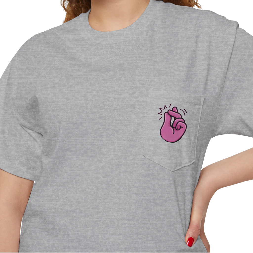 A person wearing a FREEBRD sport grey classic cotton pocket t-shirt with a baby pink cartoon finger-snap Clock It graphic printed on the front chest pocket.