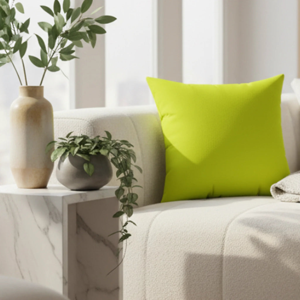 Sporty lime faux suede throw pillow styled on a sofa in a bold modern living room.