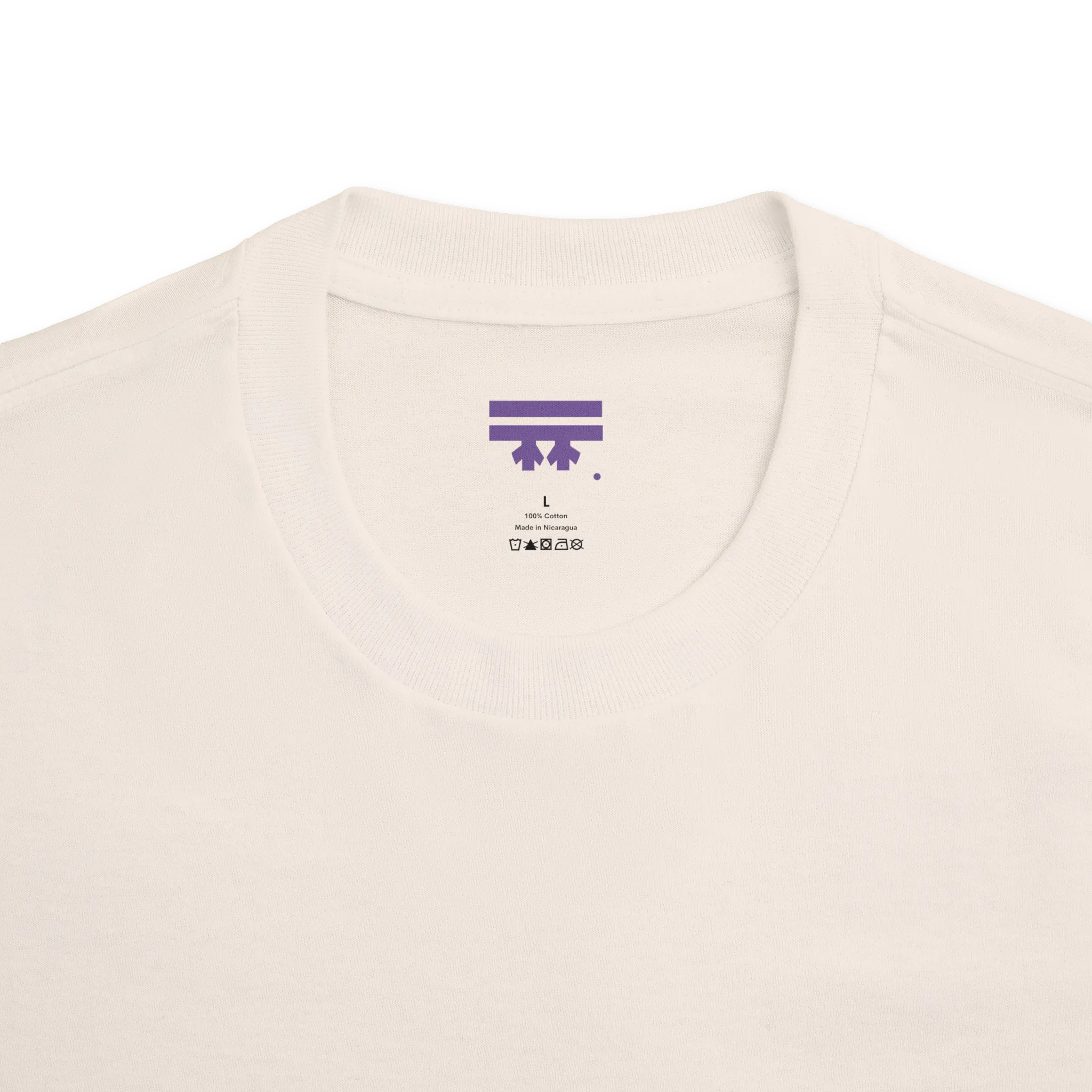 Classic fit crew neck tee, cream, collar close-up showing FREEBRD brand label, 100% cotton.