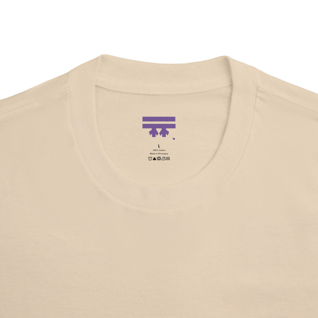 Classic fit crew neck tee, sand, collar close-up showing FREEBRD brand label, 100% cotton.