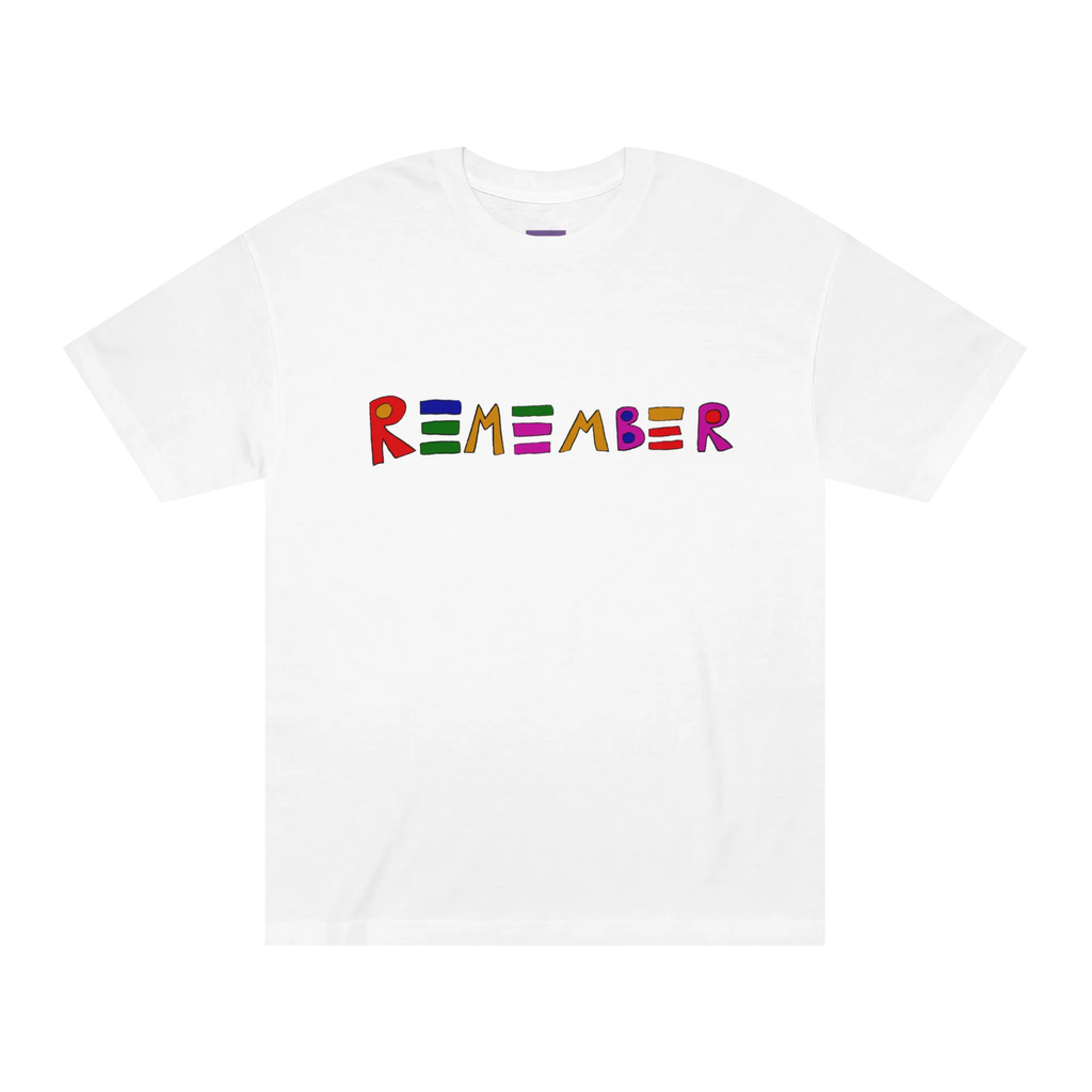 Classic fit crew neck tee, white, front view, hand-drawn multicolor lettering reading REMEMBER in red, blue, green, orange, purple, and pink.