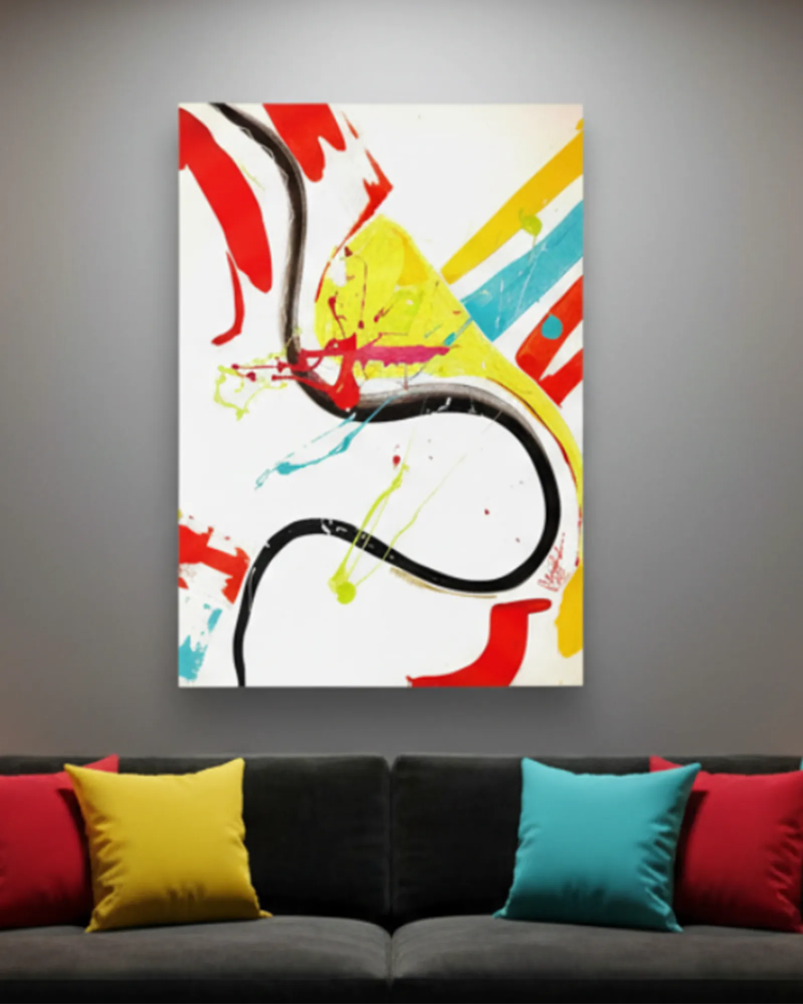 The ‘Stripe Status’ FREEBRD Abstract canvas with colorful acrylic thrown paint texture splashes and sgrafitti scrapes on a gray wall above a sofa with colorful cushions.