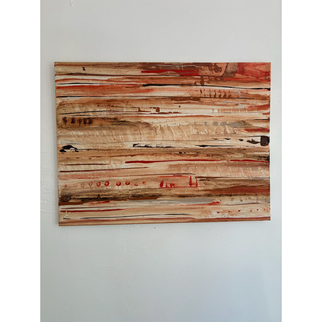 Front view of a horizontal abstract painting on a pale wall, with cream, tan, and brown layers, dark marks, and narrow red accents.