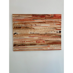 Front view of a horizontal abstract painting on a pale wall, with cream, tan, and brown layers, dark marks, and narrow red accents.