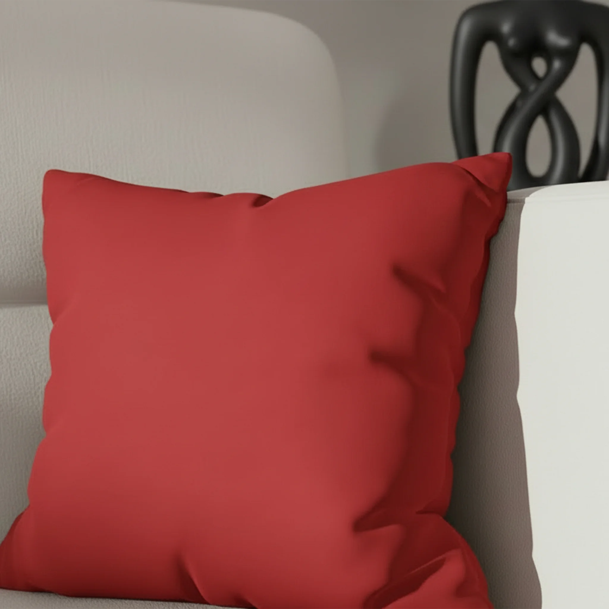 Traditional Red faux suede pillow case styled on a couch in a modern living room.