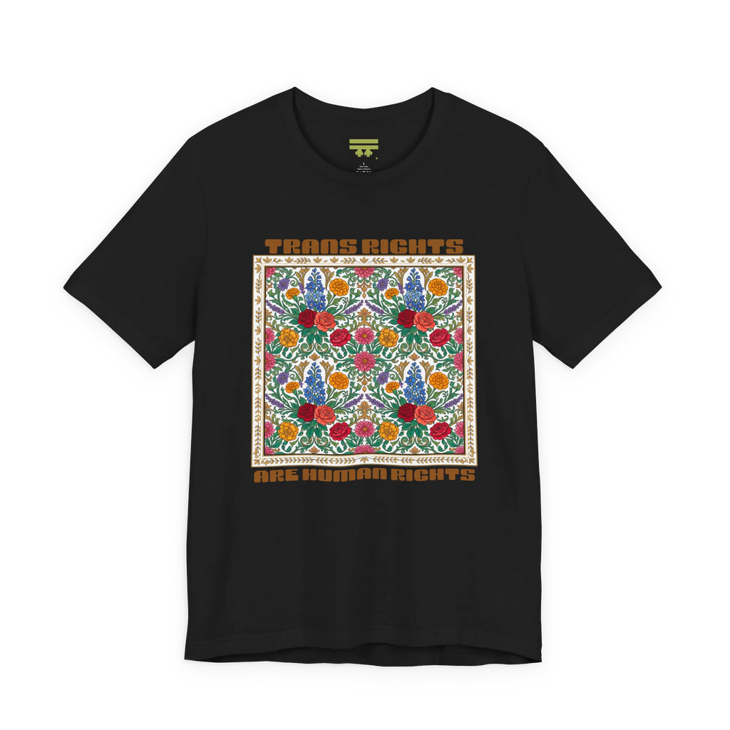 Black T-shirt with a centered floral graphic and groovy Trans Rights Are Human Rights text, front view.