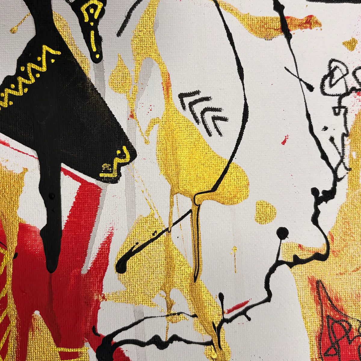 Close-up of textured gold and red paint, black flowing lines, zigzag marks, and part of a black figure-like shape on a white surface.