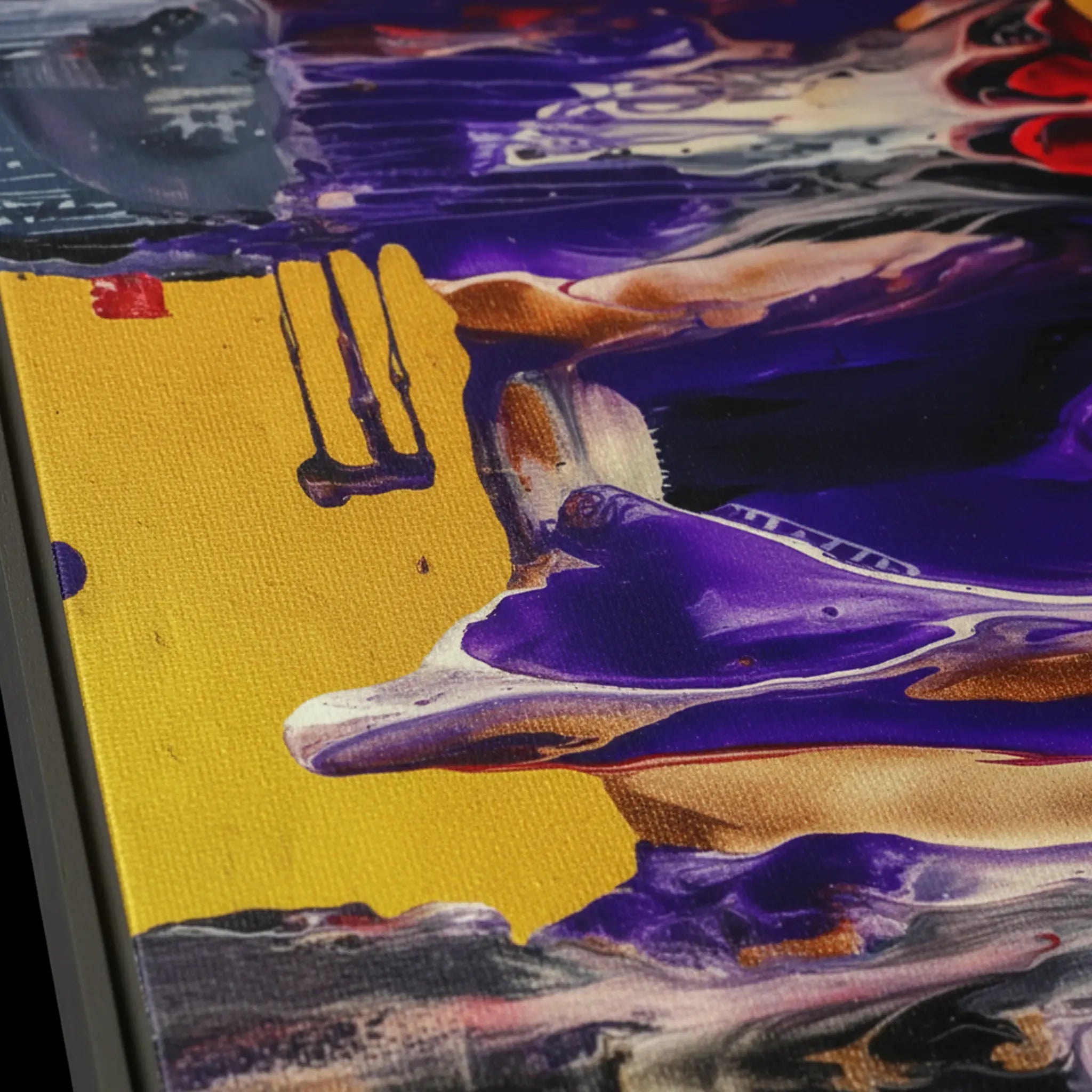 Close-up texture detail of "Tribal Wave" framed abstract canvas by FREEBRD — fluid pour art in purple, red, yellow and black with tribal accents on premium DTF canvas with black wood frame and archival matte finish.
