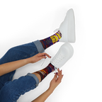 All-over print crew socks with abstract Tribal Wave art worn with white sneakers, person lacing up, lifestyle view.