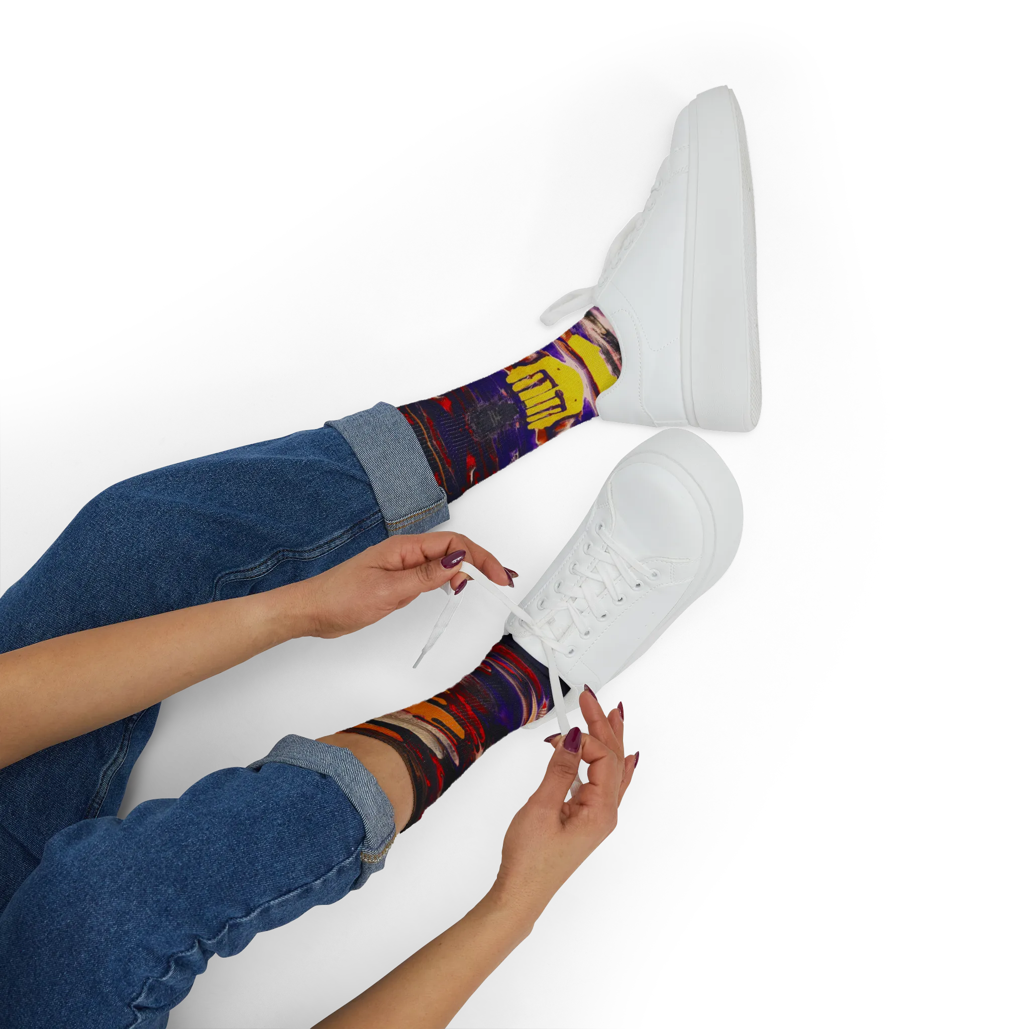 All-over print crew socks with abstract Tribal Wave art worn with white sneakers, person lacing up, lifestyle view.