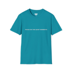 A tropical blue t-shirt with grey Focus On The Quiet Moments text on the chest.