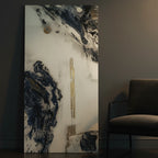 "Tu Gough" 24x48 vertical gallery-wrapped abstract canvas by FREEBRD leaning against a modern interior wall beside a contemporary accent chair — size reference for large vertical abstract wall art decor.