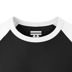 Close-up of the white collar and inner neck of a black raglan shirt, showing a white FREEBRD logo.