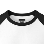 Close-up of the black collar and inner neck of a white raglan shirt, showing a black FREEBRD logo.