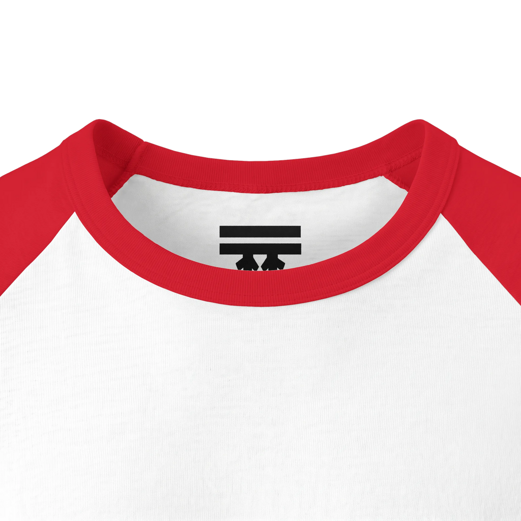 Close-up of the red collar and inner neck of a white raglan shirt, showing a black FREEBRD logo.