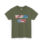 Military Green crew neck T-shirt with ‘WE ARE ALL HUMAN’ across the chest in pink and blue watercolor-style lettering, front view.