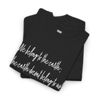 Black cotton tee upper-chest and collar detail showing the ribbed neckline and partial white handwritten lettering.