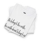 White cotton tee upper-chest and collar detail showing the ribbed neckline and partial black handwritten lettering.
