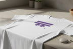 The Freebrd Logo Classic T-Shirt in white that has a purple Freebrd Logo on the chest, lying on a concrete counter with a stone for a soft-brutalist vibe. 