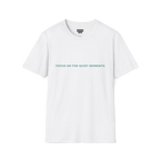 A white t-shirt with sage green Focus On The Quiet Moments text on the chest.