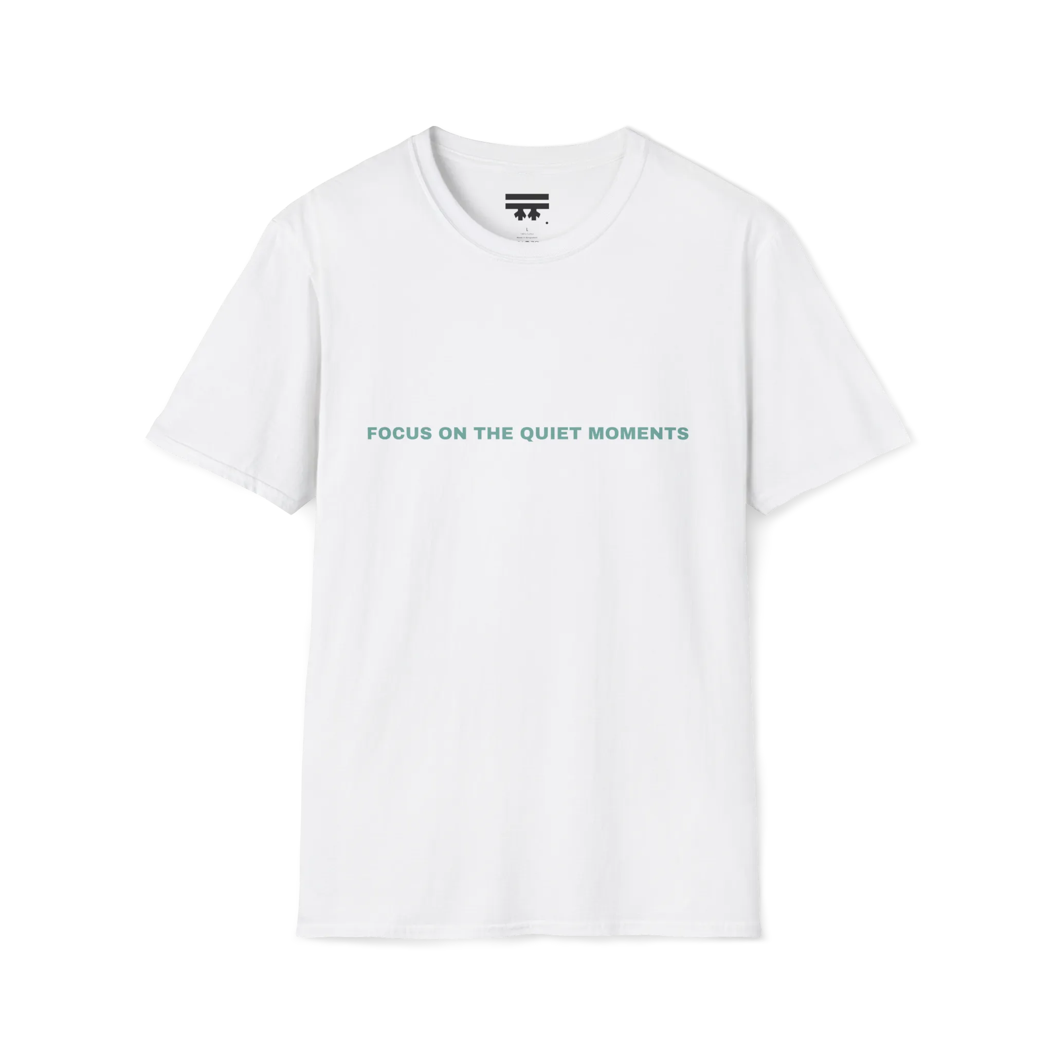 A white t-shirt with sage green Focus On The Quiet Moments text on the chest.