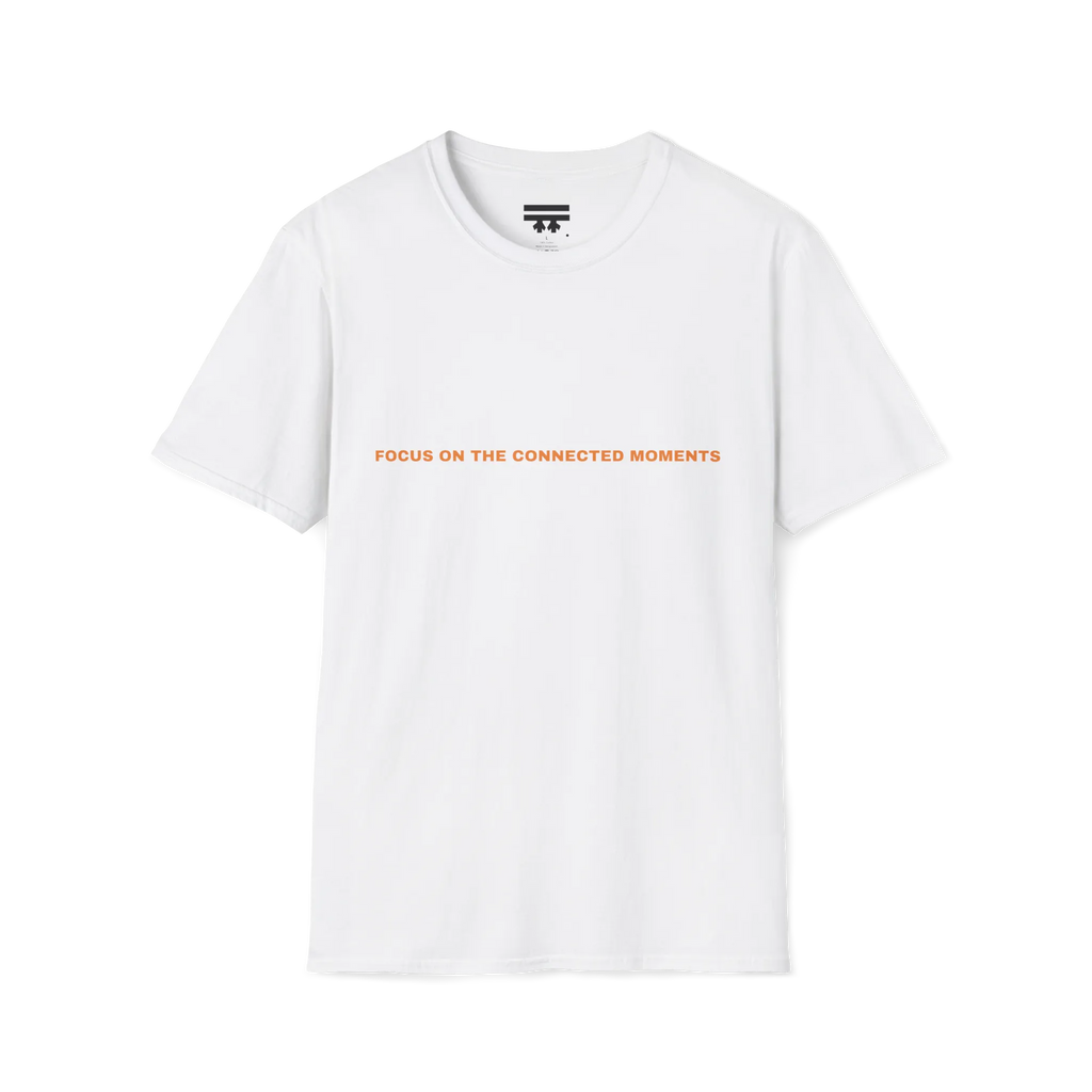 A white t-shirt with orange Focus On The Connected Moments text on the chest.
