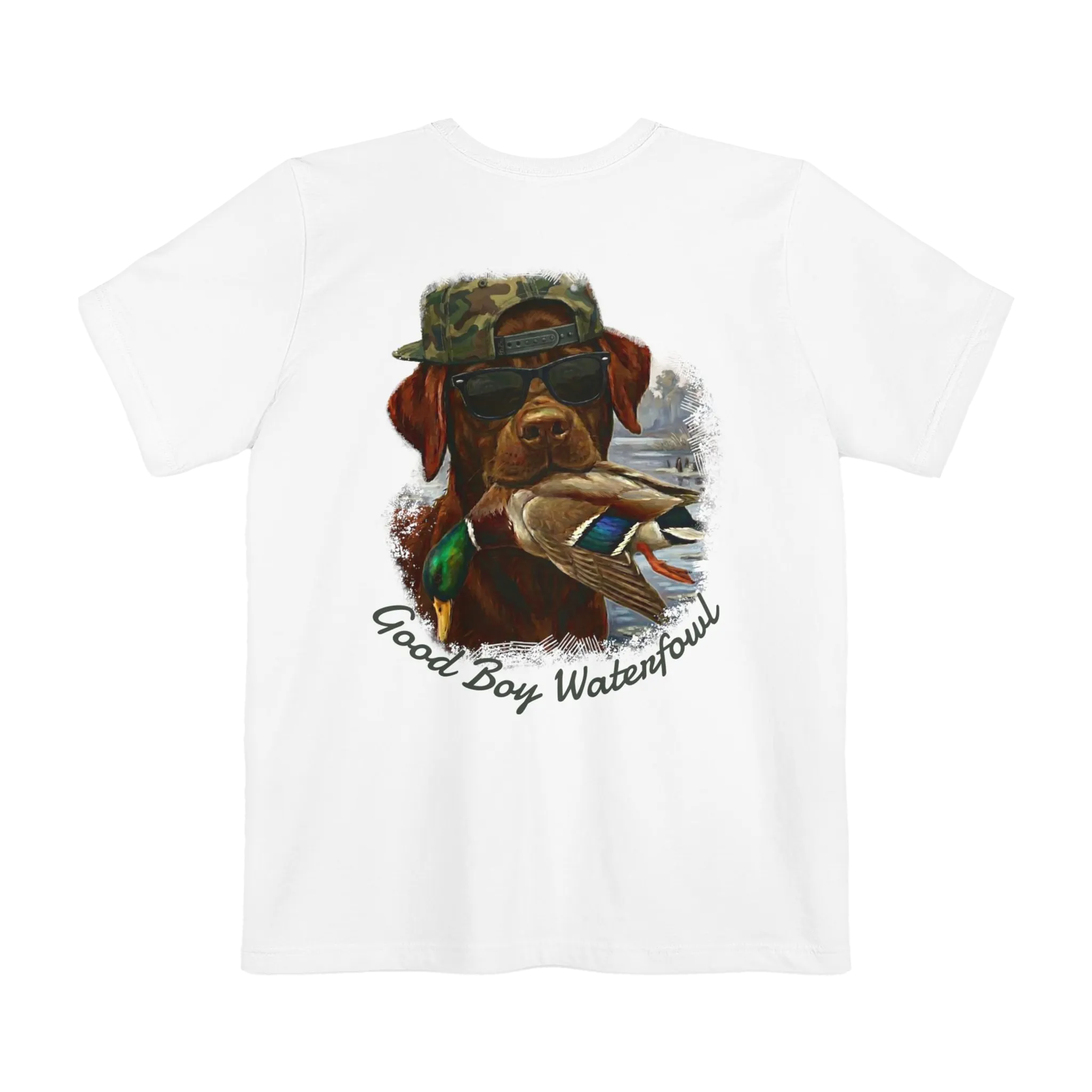 A white t-shirt featuring the Good Boy Waterfowl graphic of a chocolate Labrador wearing sunglasses and a camo snapback, holding a mallard duck, with a watercolor outdoor scene and 'Good Boy Waterfowl' script below.