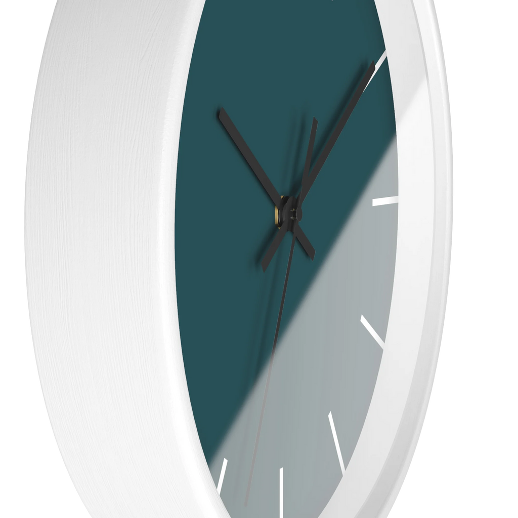 Abstract teal silent wall clock, white base, black hands, white markers, 10 inch, side view.