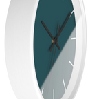 Abstract teal silent wall clock, white base, black hands, white markers, 10 inch, side view.