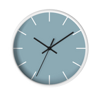 Danish blue minimalist wall clock with white wooden base, black hands, and white markers, front view.