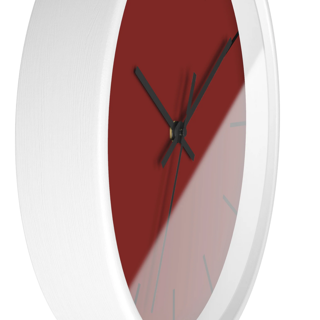 Maroon bloodstone red silent wall clock, white base, black hands, black markers, 10 inch, side view.