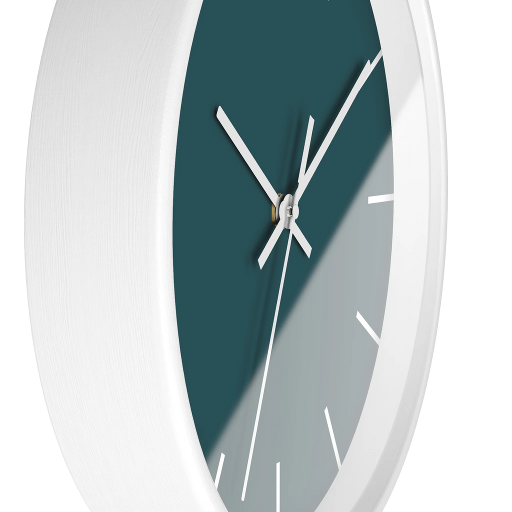 Abstract teal silent wall clock, white base, white hands, white markers, 10 inch, side view.
