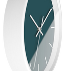 Abstract teal silent wall clock, white base, white hands, white markers, 10 inch, side view.