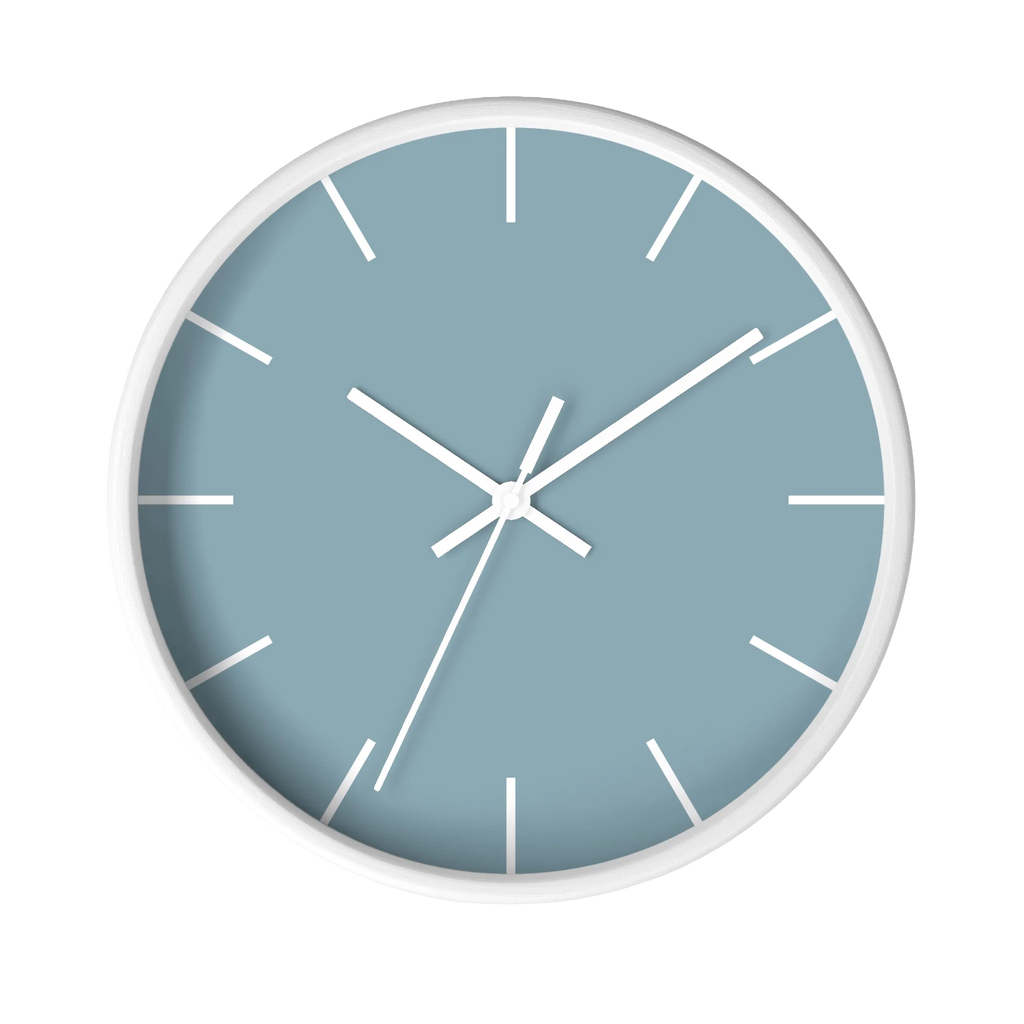 Danish blue minimalist wall clock with white wooden base, white hands, and white markers, front view.